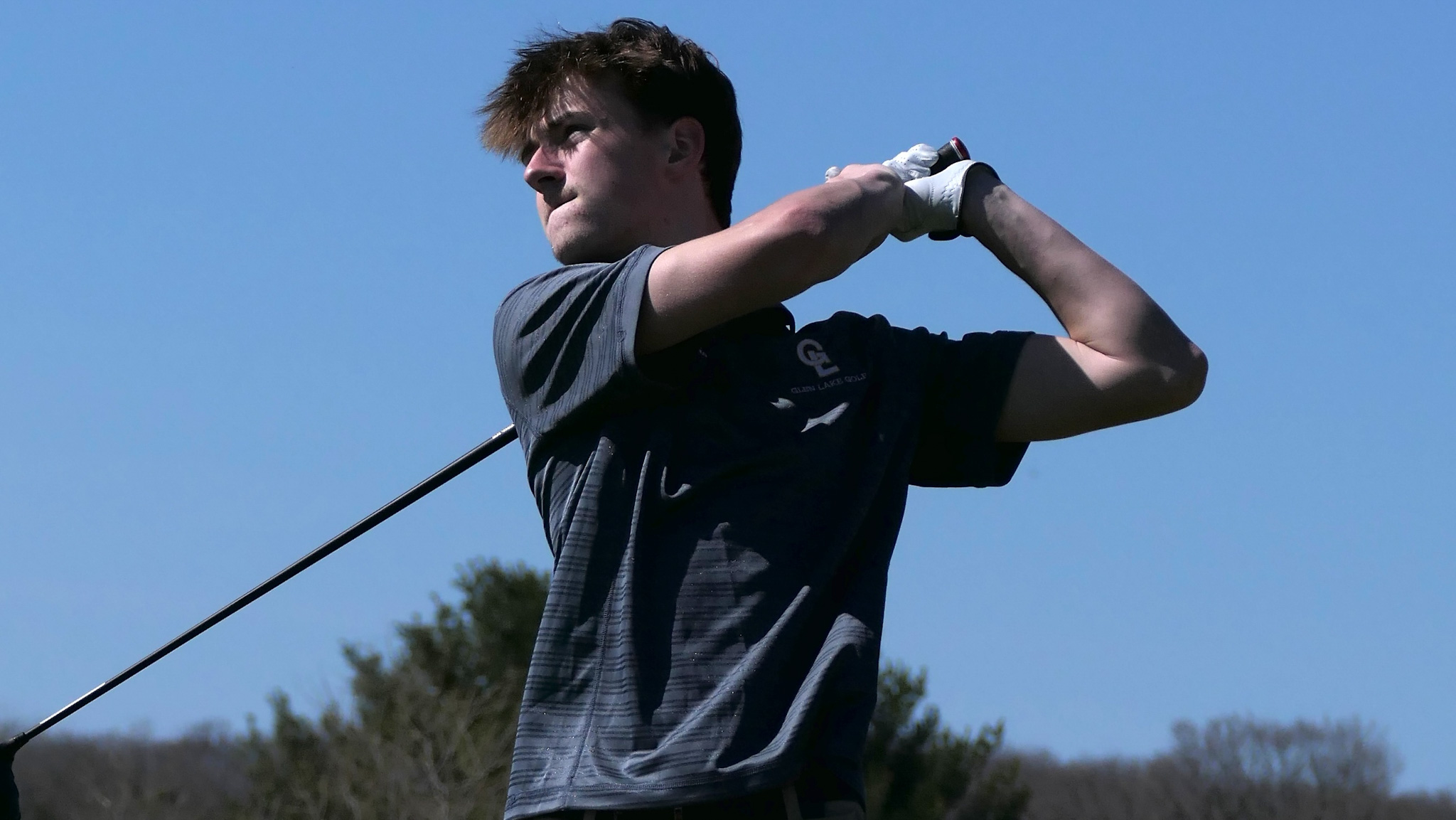 closeup of golfer swinging